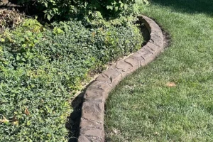 decorative stone edging around bushes